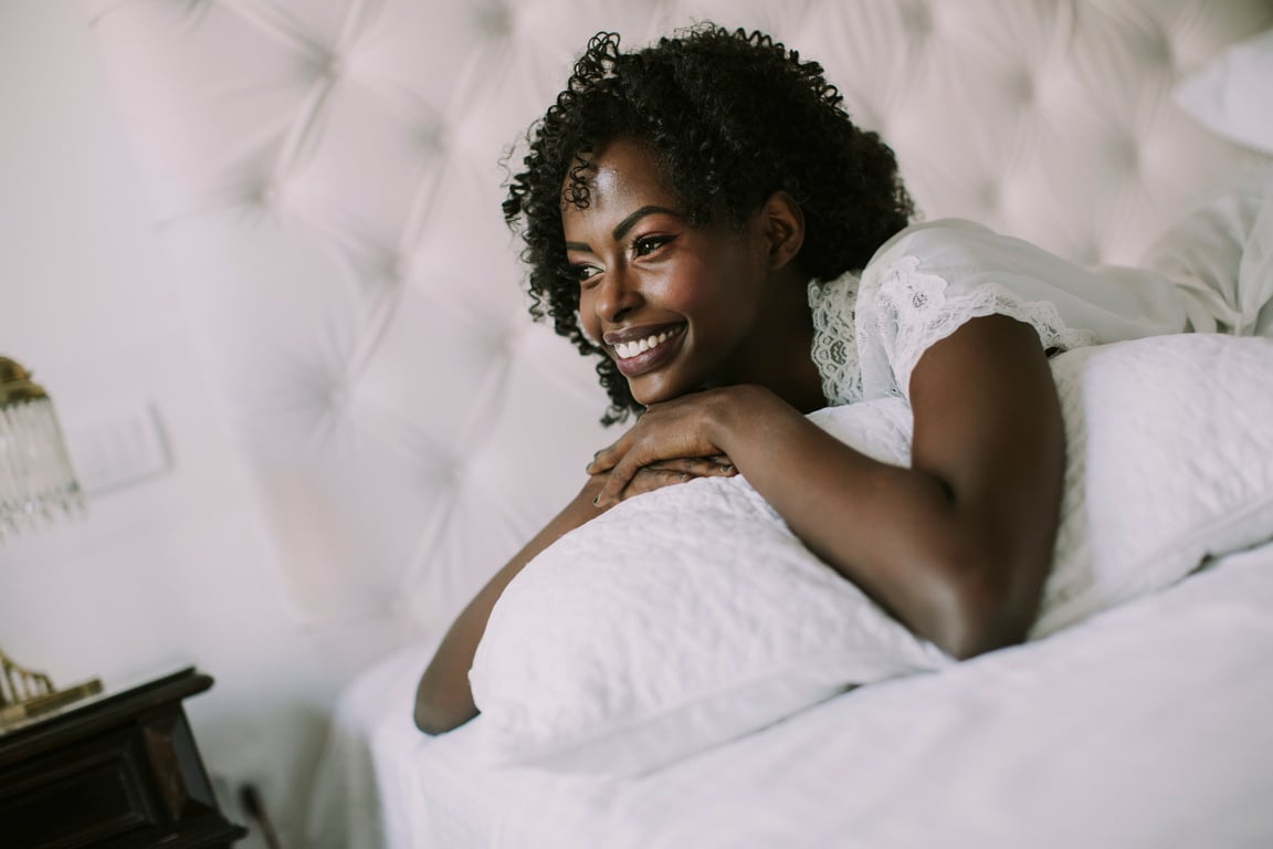 Young Black Woman in Bed